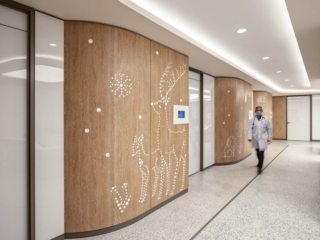 the hallway of Acibadem Healthcare Group, with winter motifs built into the walls