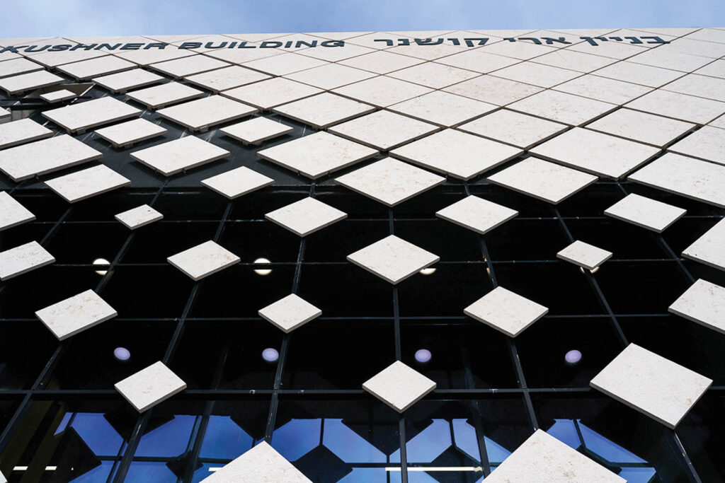 monochrome diamond-shape slabs on the exterior of an Israeli performing arts school