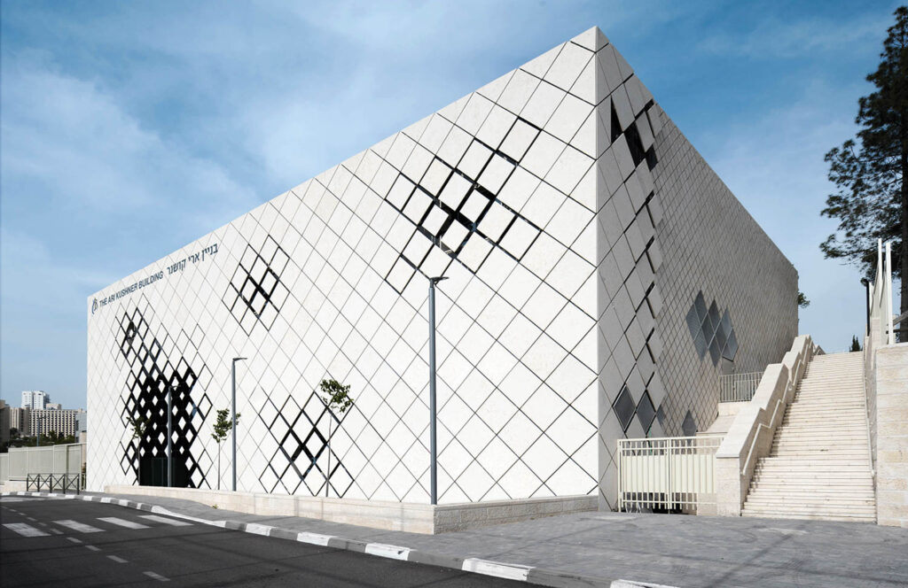 monochrome diamond-shape slabs on the exterior of an Israeli performing arts school
