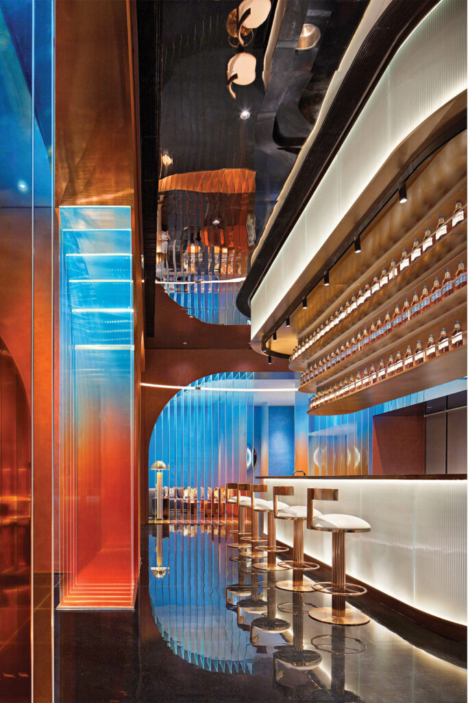 blue and red hues surround the bar in le bar