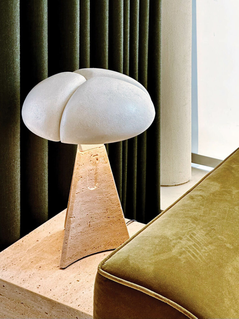 a table lamp with an organic shape inside a design firm's office