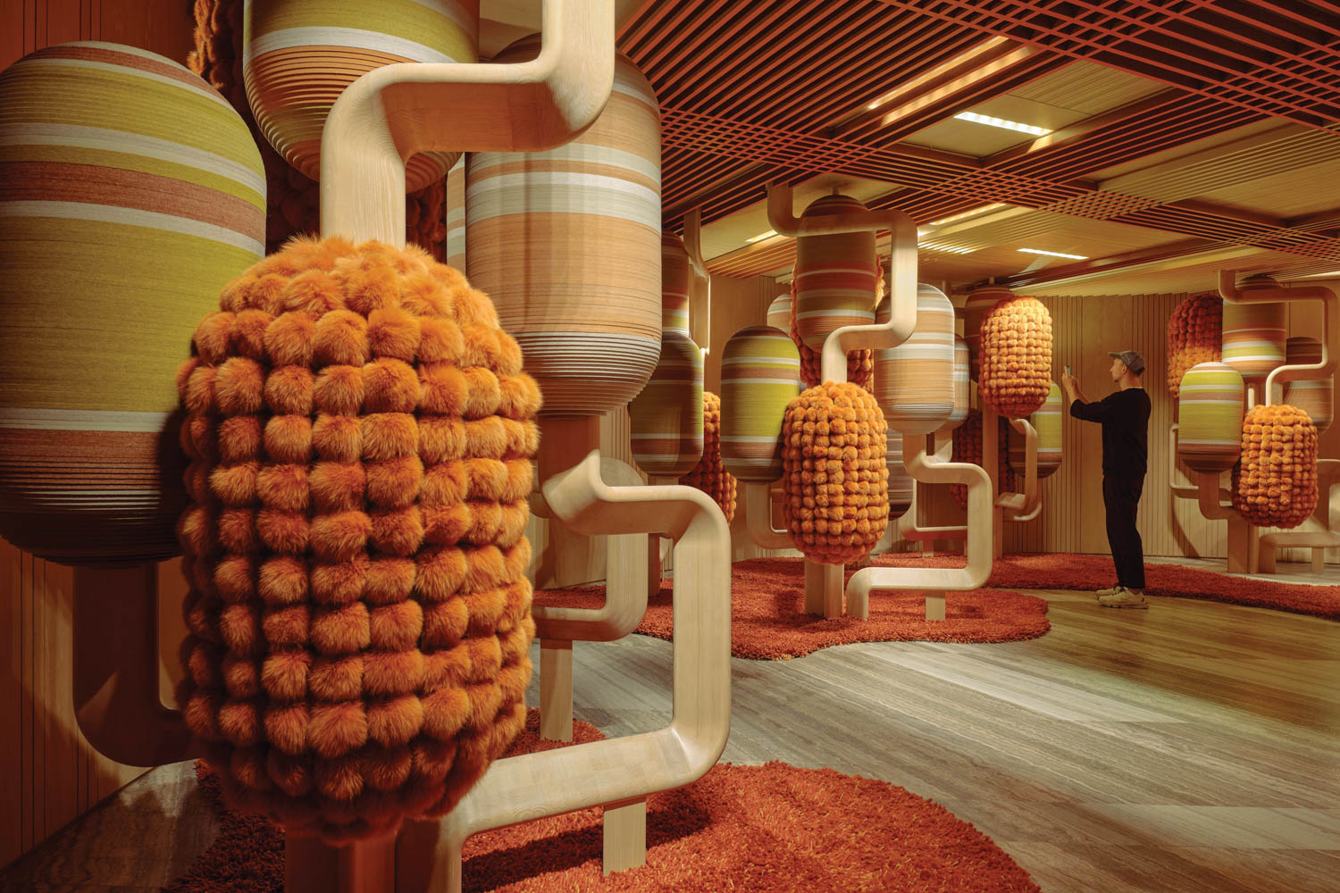 orange puffball installations inside a residential sales center