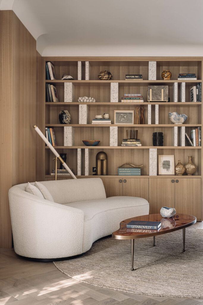 a built in bookcase with carefully curated shelves