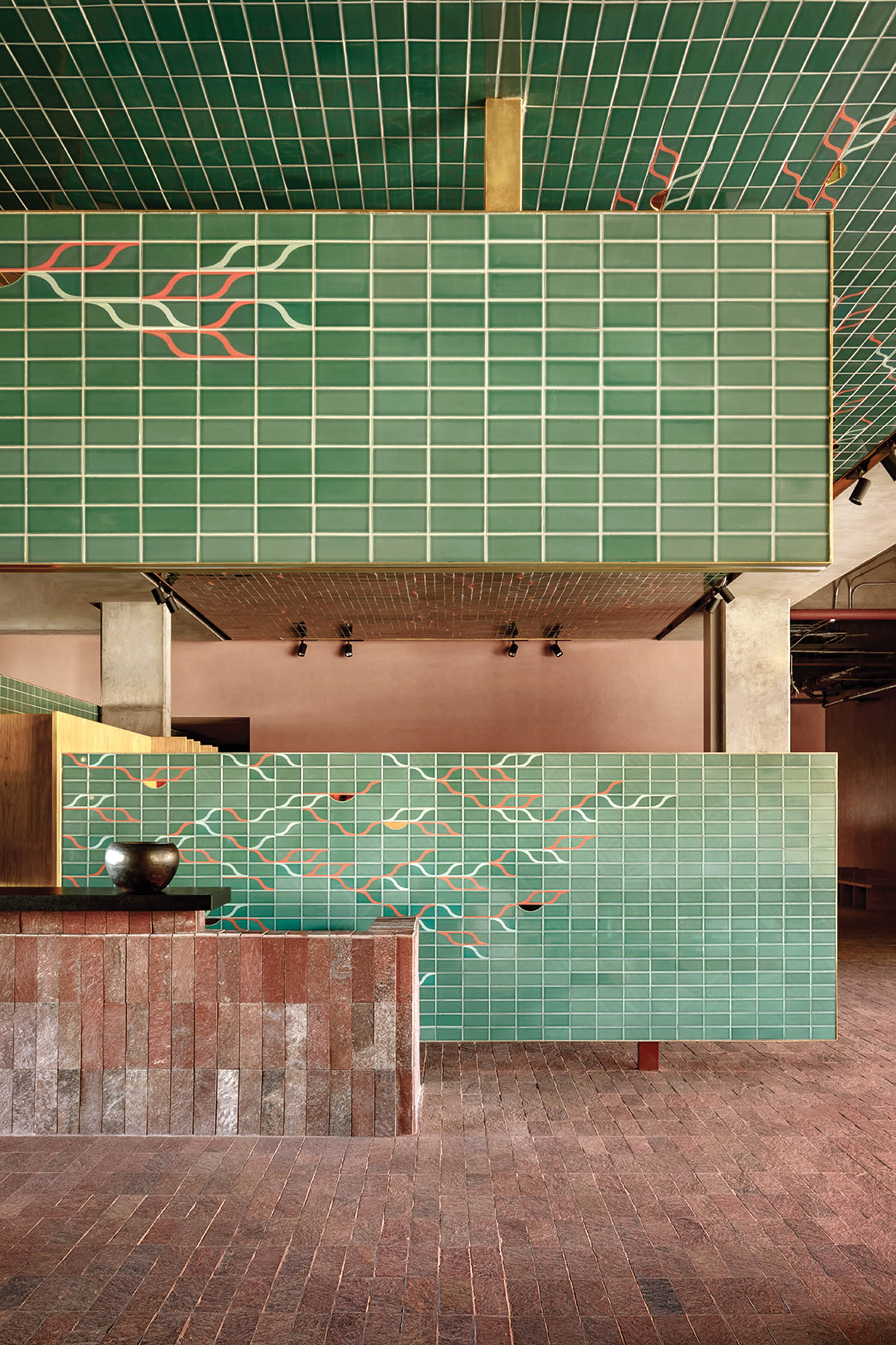 green ceramic sculptural elements in the lobby of a hotel