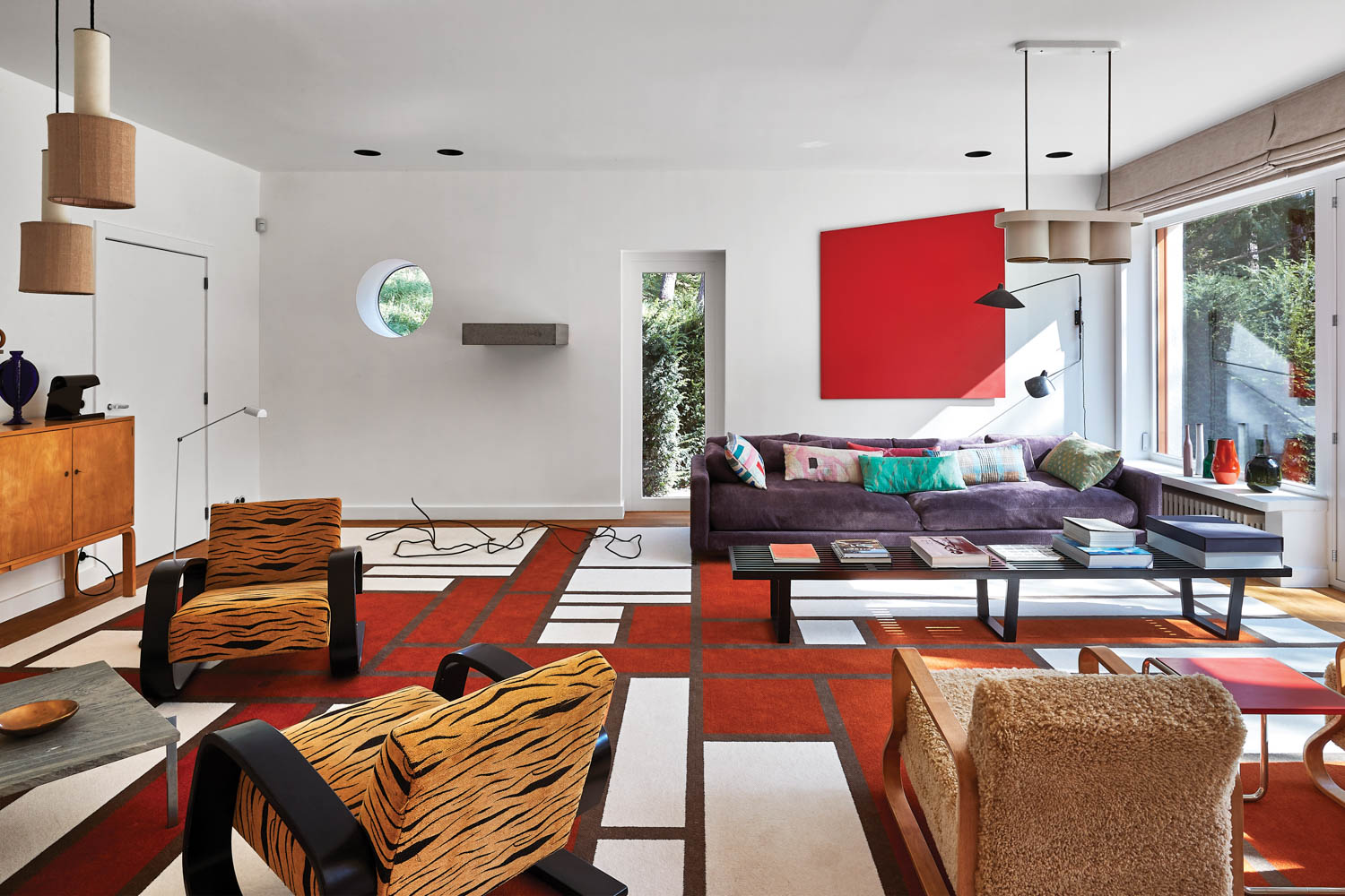 graphic carpets in a living room with a porthole window