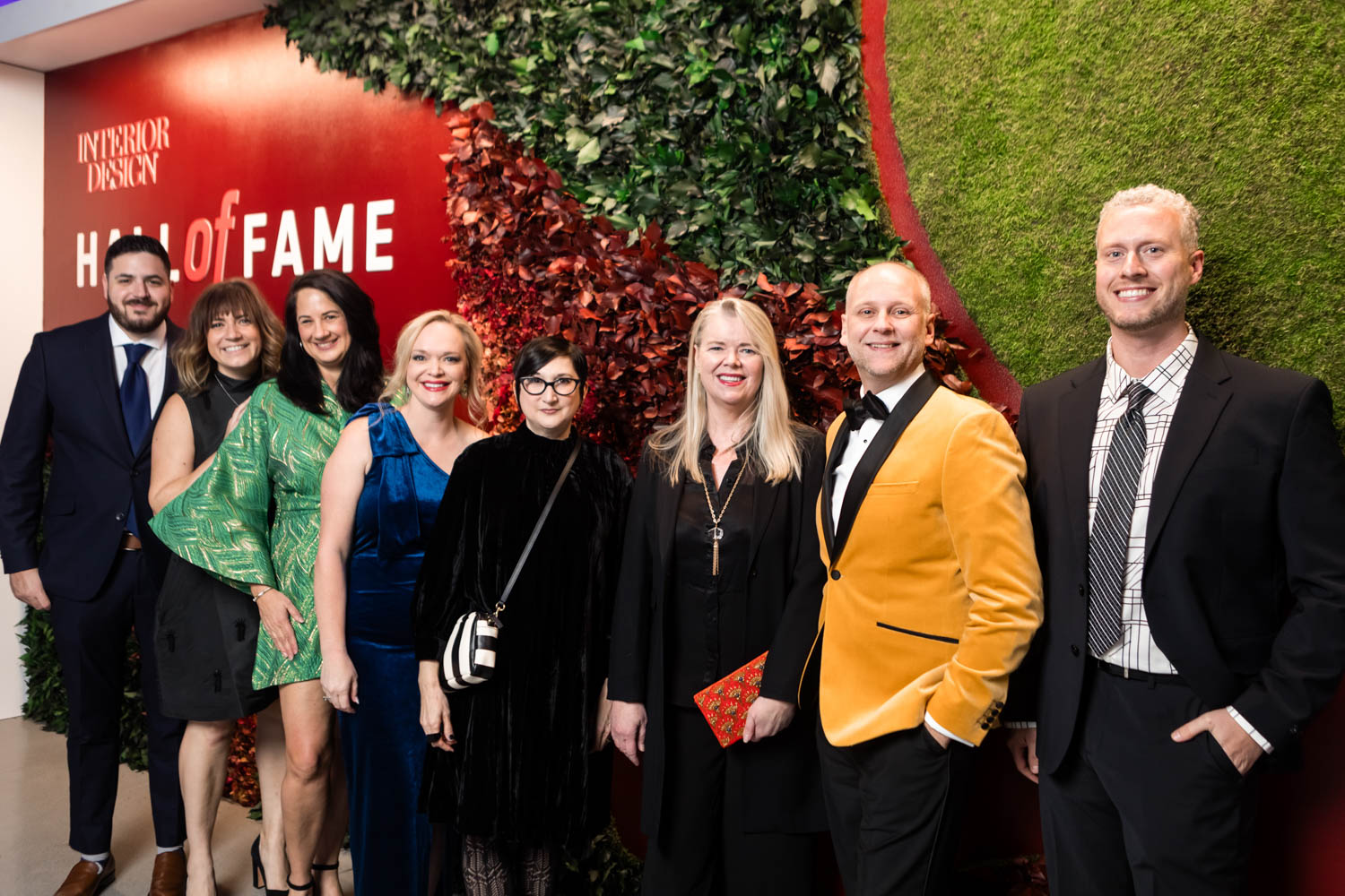 Hall of Fame attendees in front of the Garden on the Wall installation