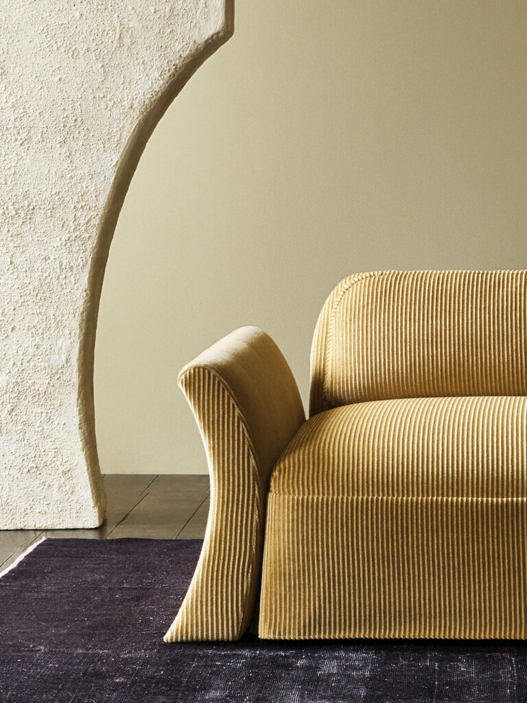 uphol­stered yellow sofa, shown in mohair-cotton cord