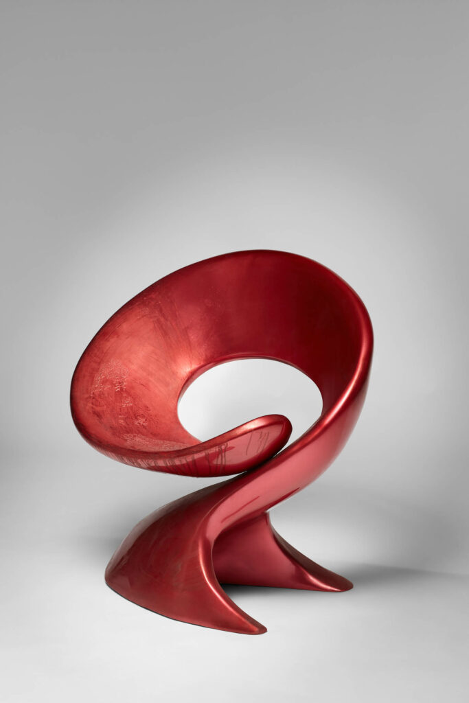 ribbonlike red chair by Louis Durot