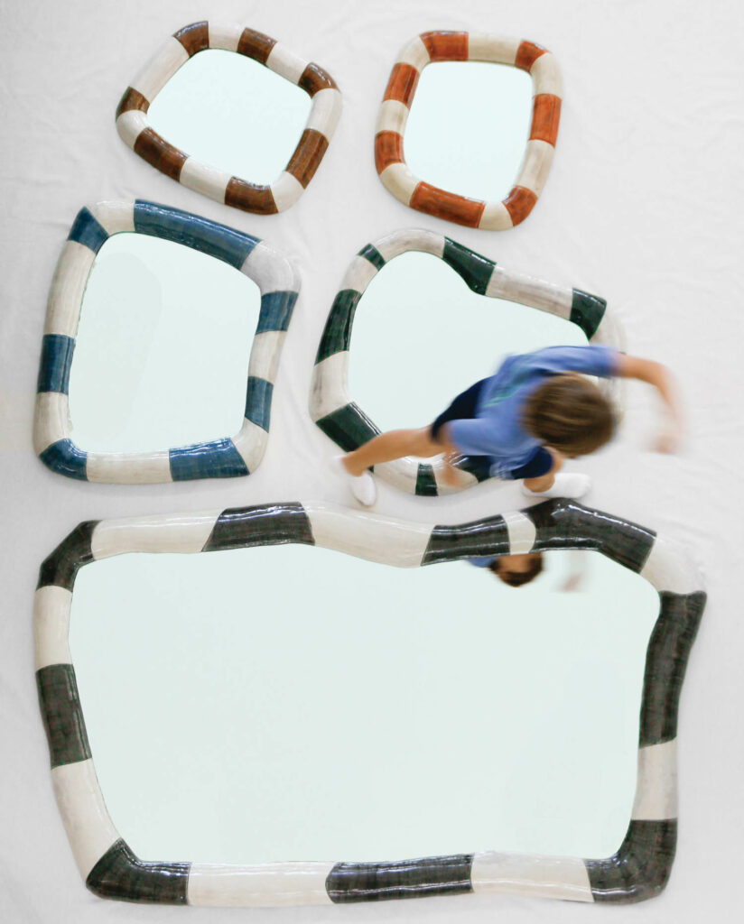 mirrors in biomorphic shapes with ceramic borders