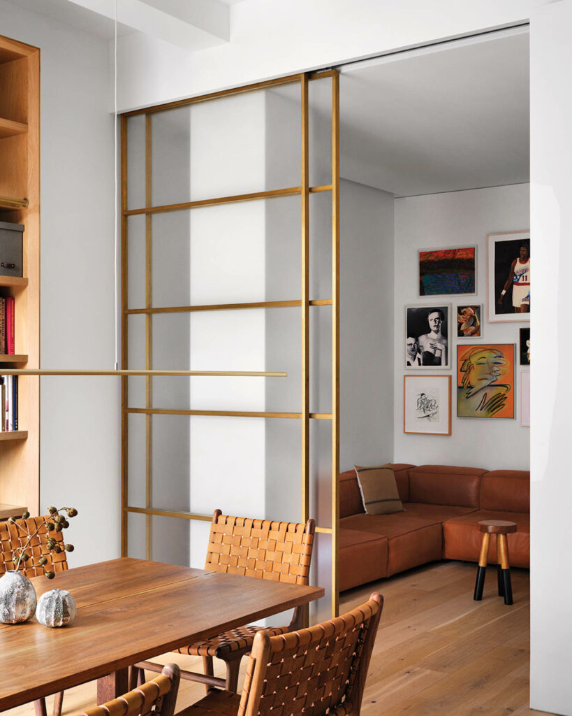 More bronze-framed glass panels enclose the den off the dining area.