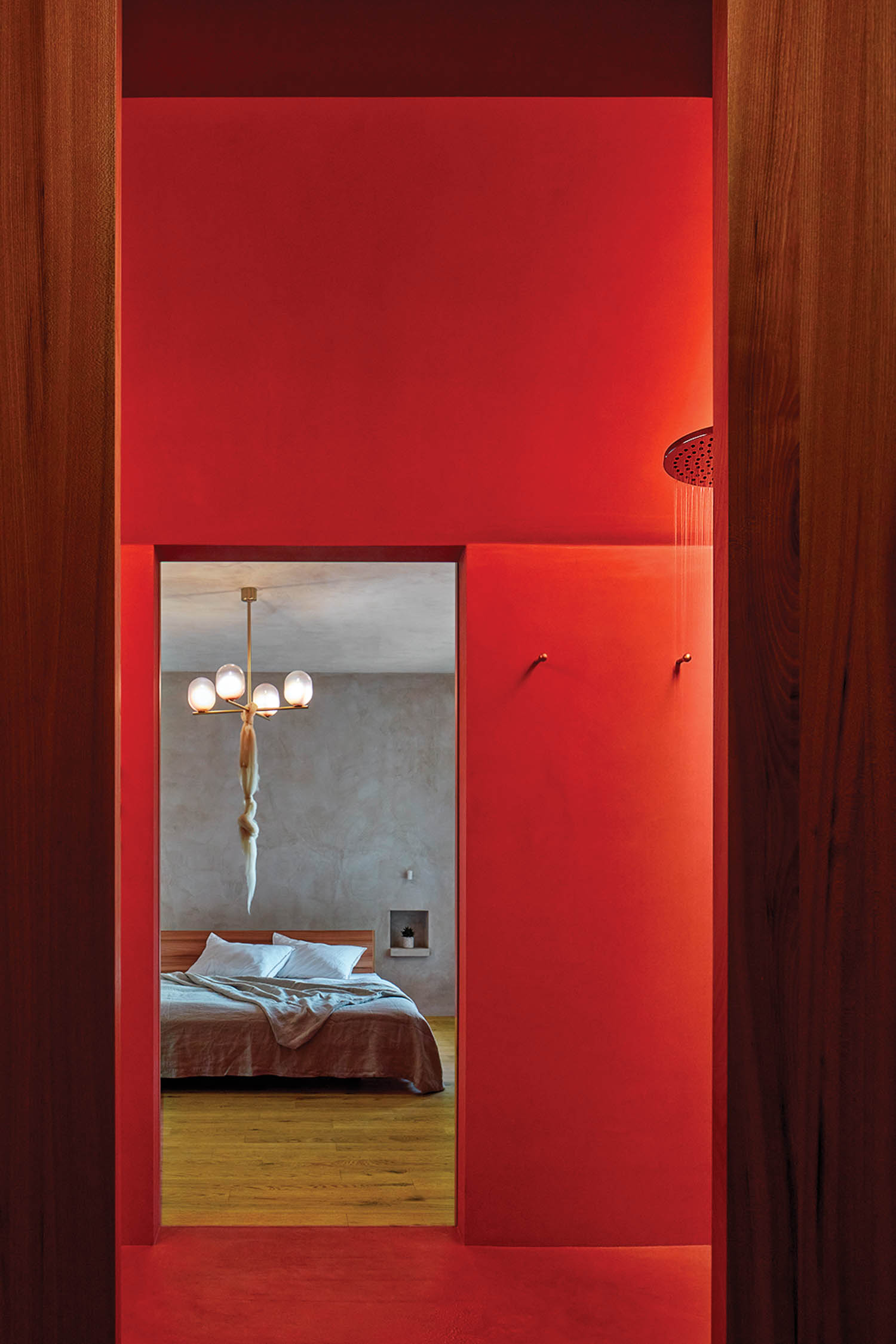 a red-painted shower room