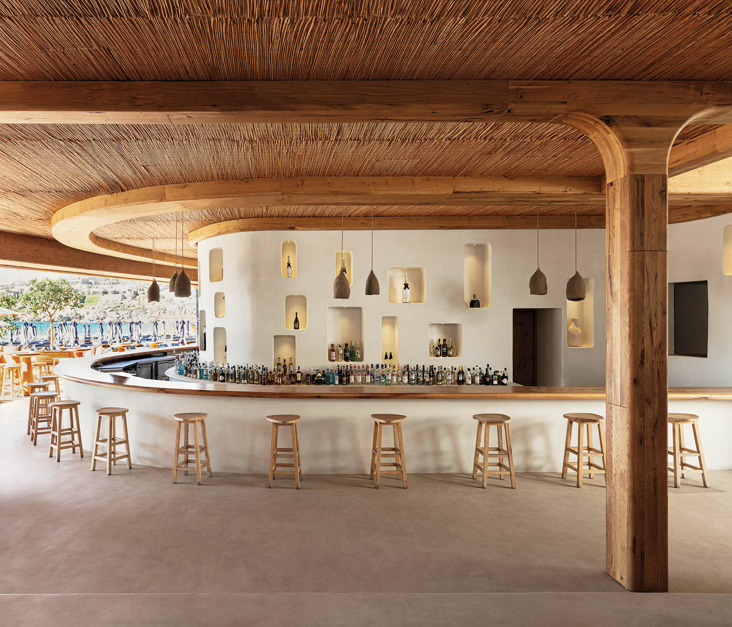 a wood-ceilinged bar at Super Paradise Beach Club in Mykonos