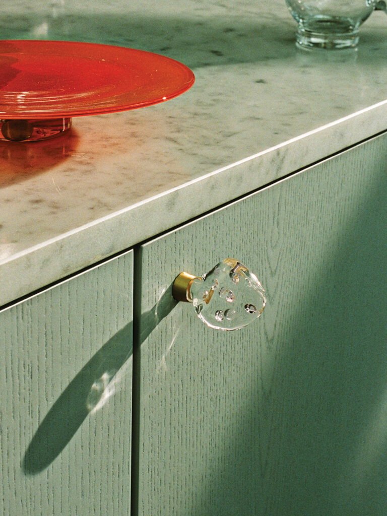 a glass door pull with gold flecks
