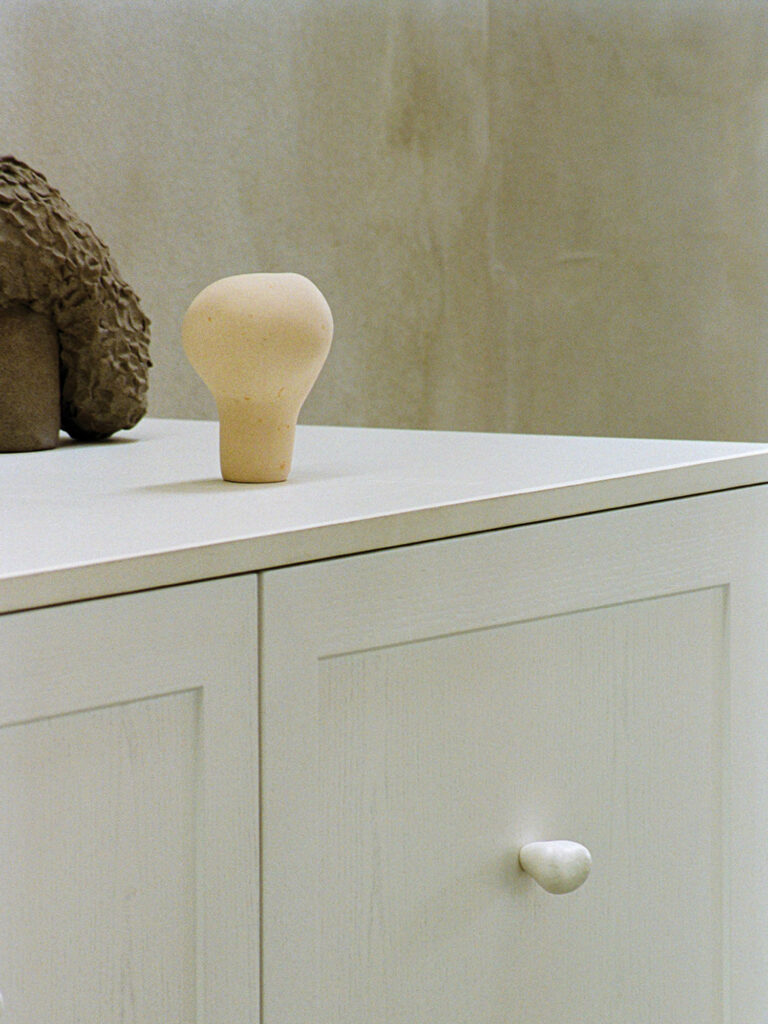 a cream colored handle on a counter