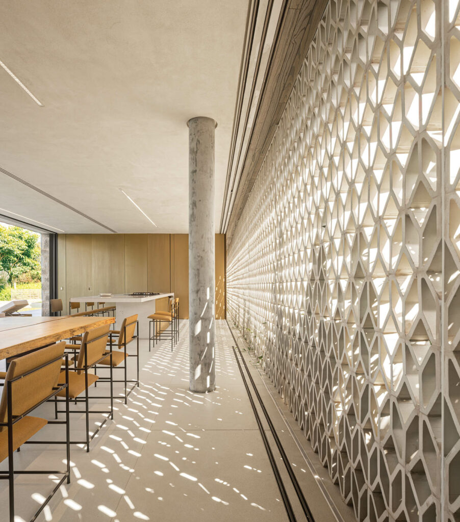 a brise-soleil of hollow Y-shaped blocks lets light into the kitchen and dining room