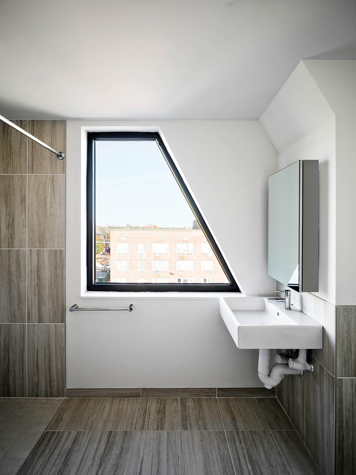 a geometric window in a bathroom